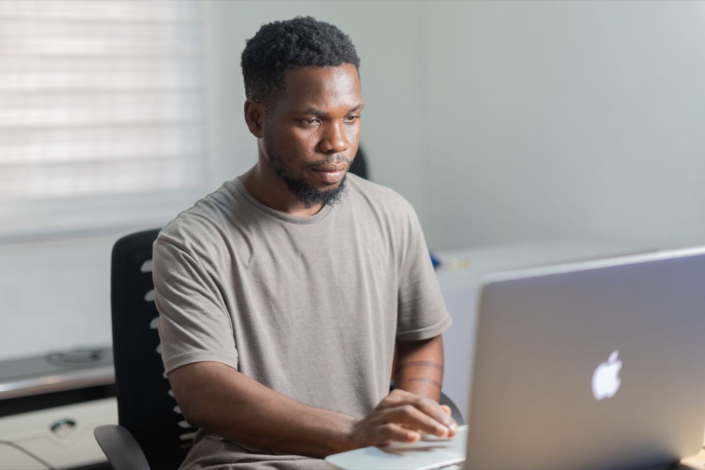 A member of the Aligned Business Consultancy team reviewing figures at his desk